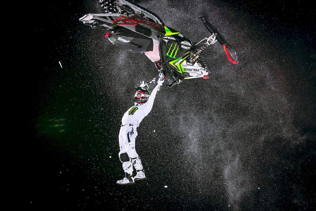 Joe Parsons takes the backward approach in snowmobile freestyle