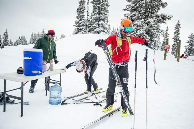 Billy Laird celebrates after crossing the finish line of Saturday's Power of Four ski mountaineering race at the base of Aspen Mountain.