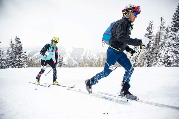 Billy Laird, right, and Brian Smith embrace at the base of Aspen Mountain after winning Saturday's Power of Four Ski Mountaineering Race.