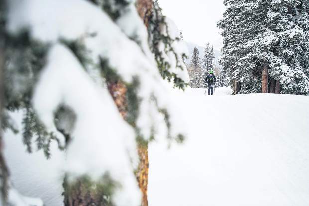 Stig Somme skins up to the top of Ajax for the Power of 4 ski mountaineering race on Saturday.