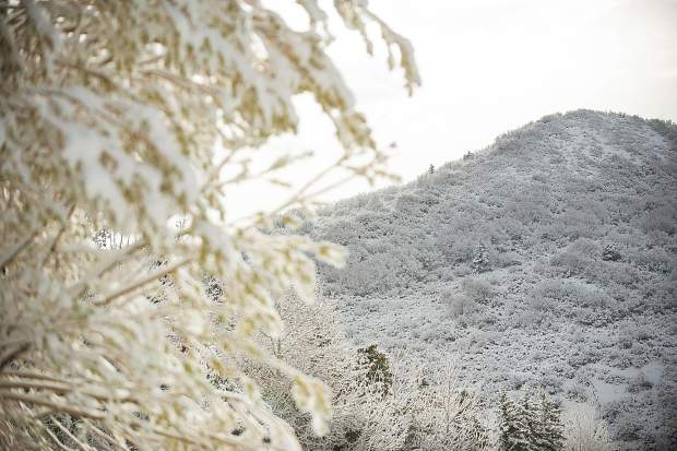 The sun slightly lit up the fresh snow this morning in Snowmass.