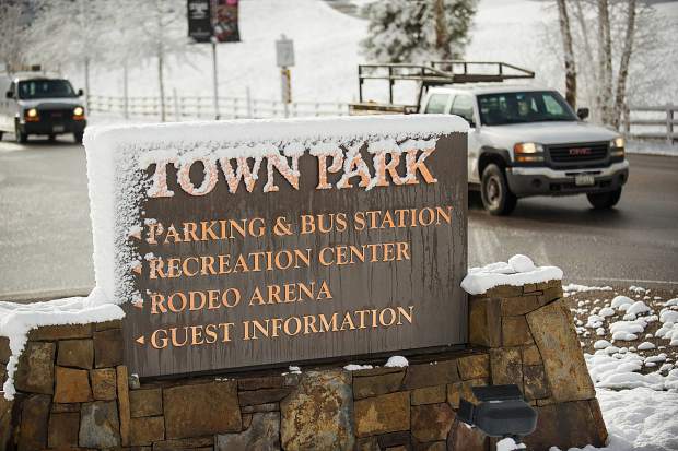 Morning commuters drive by the fresh snow in Snowmass today.