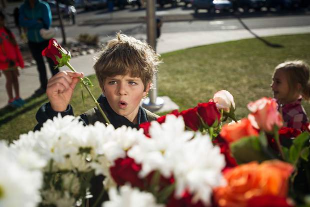 Leo H., 6, purchases flowers for his teacher at Basalt Elementary for Teacher Appreciation Week at Basalt Elementary on Wednesday.