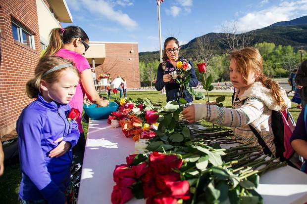 Mikayla Stuhaug, 7, purchases flowers for her teacher at Basalt Elementary for Teacher Appreciation Week at Basalt Elementary on Wednesday.