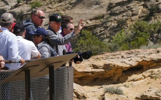 U.S. Interior Secretary Ryan Zinke is joined by San Juan County Commission Chairman Phil Lyman as he overlooks the Butler Wash Indian Ruins within the Bears Ears National Monument in Utah on Monday.