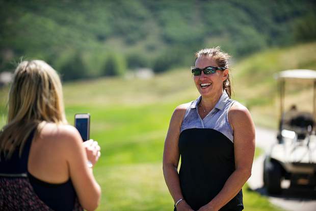 Nicki Cader, right, got a hole in one at the Snowmass Club for the Challenge Aspen benefit known as the Vince Gill and Amy Grant 14th Anniversary Gala and Golf Classic on Tuesday.