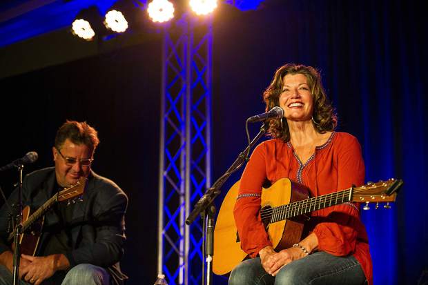 Amy Grant and Vince Gill performing at the Challenge Aspen benefit known as the Vince Gill and Amy Grant 14th Anniversary Gala and Golf Classic at the St. Regis Monday evening.