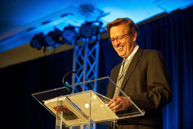 Challenge Aspen founder Houston Cowan laughing during part of his speech at the Vince Gill and Amy Grant 14th Anniversary Gala and Golf Classic at the St. Regis Monday evening.