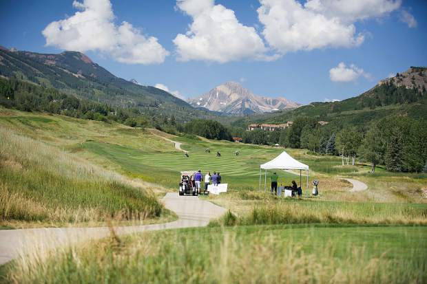 Golfers at hole 11 at the Snowmass Club for the Challenge Aspen benefit known as the Vince Gill and Amy Grant 14th Anniversary Gala and Golf Classic on Tuesday.