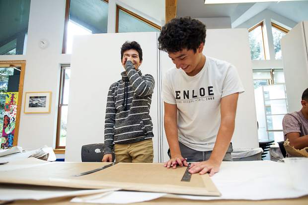 Ulysses, right, and Jaciel have a laugh while working on their Basalt Art Base mural on October 6.
