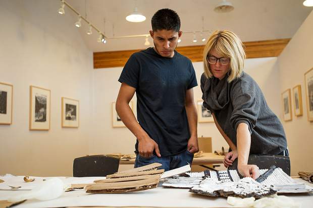 Andres, and Artist/sculptor Ajax Axe working on the mural at the Basalt Art Base on October 6.