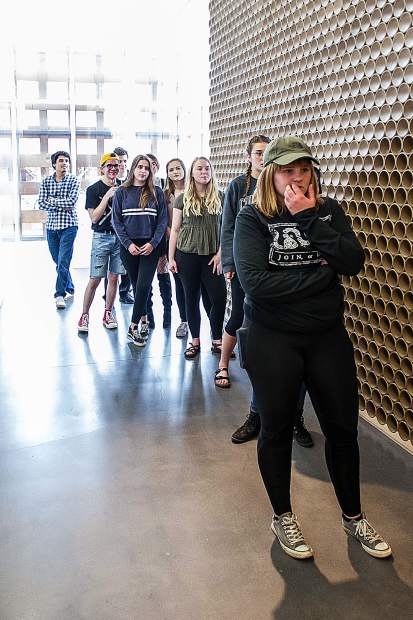Young curators mull over artwork placement at the Aspen Art Museum on Tuesday.