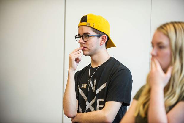 Sebastian Arreola mulls over artwork placement at the Aspen Art Museum on Tuesday.
