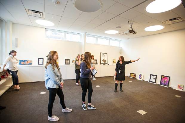 Young curators mull over artwork placement at the Aspen Art Museum on Tuesday.