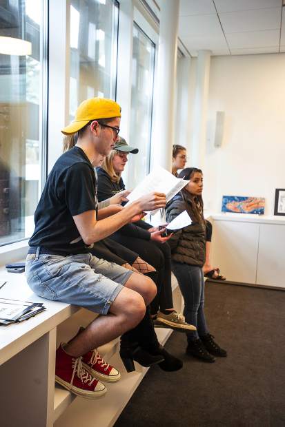 Young curators mull over artwork placement at the Aspen Art Museum on Tuesday.