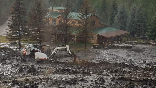 A mudslide onto Ace Lane's property threatened a structure on Saturday. Work with an excavator and other equipment diverted the debris.