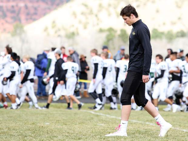 Basalt High School senior quarterback Miles Levy walks off the field following the team's loss to D'Evelyn in the first round of the 2016 Class 2A playoffs. Levy was injured late in the first half and did not return.