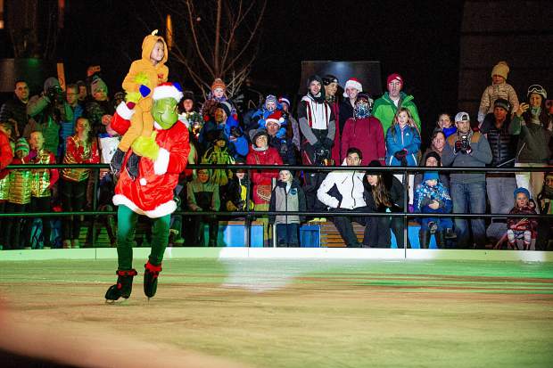 The Grinch or Kelly Smith performing as The Grinch Saturday night in the Snowmass Base Village plaza.