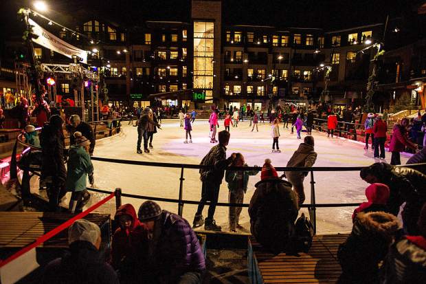 Skaters enjoy the ice rink in Snowmass Base Village Saturday night after the performances for the grand opening.