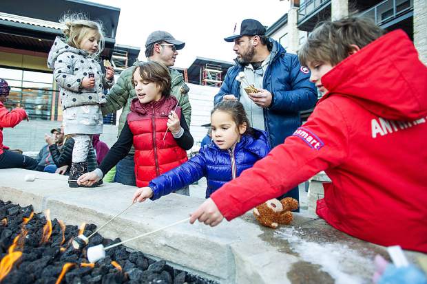 Right to left, Jagger, 7, Chloe, 4, Jack, 7, and Mila, 3, roast marshmellows Saturday at Snowmass Base Village.