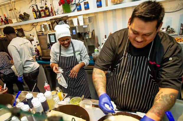 Mawa McQueen and her chef Julio Suriano have a laugh opening night of her crepe shack in Snowmass Base Village on Saturday night.