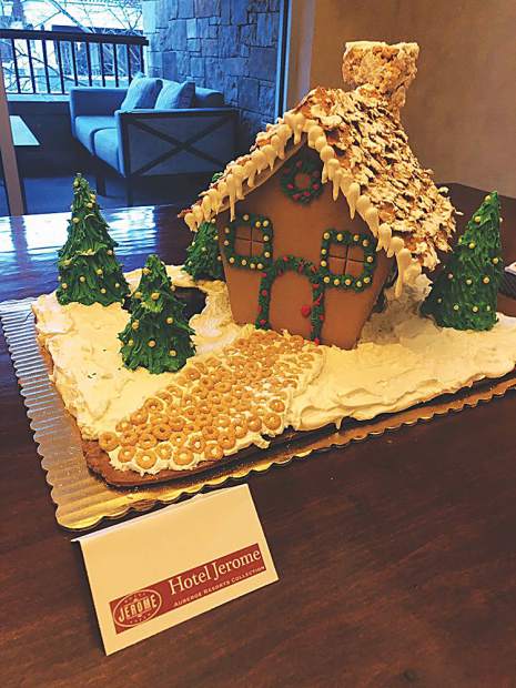 A gingerbread house creation by the Hotel Jerome's pastry chef on display at Residences at The Little Nell.