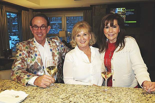 Gingerbread Workshop hosts Jim and Helen Fifield with Angie Stewart at the reception at Residences at The Little Nell.