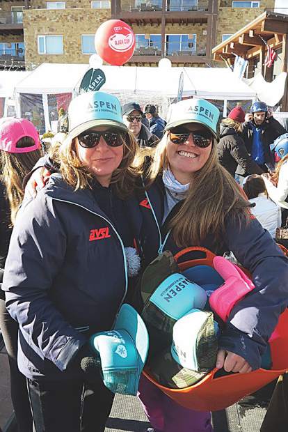 AVSC's Susan Muenchen and Katie Houser hand out trucker hats.