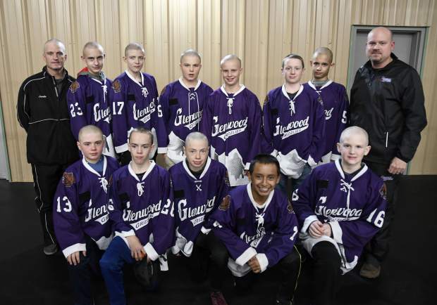 The Glenwood Grizzly Bantam Hockey team pose for a picture after they shaved their heads Thursday.
