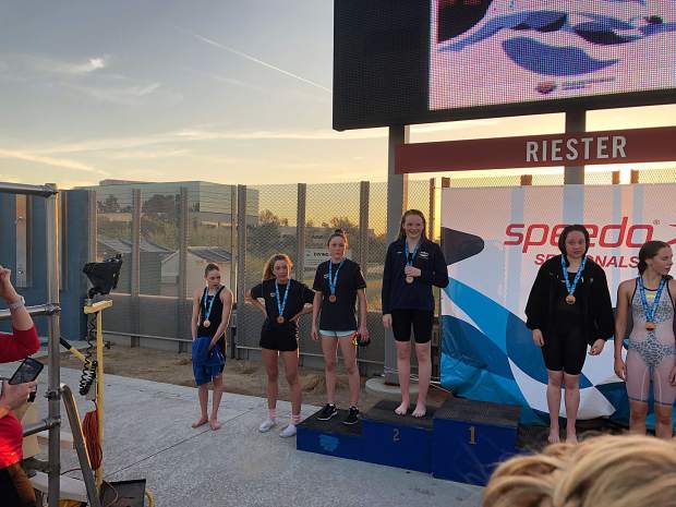 Aspen Swim Club's Lillie Boggs, far left, stands on the podium after taking eighth in the mile at the 2019 Four Corners sectional meet in Arizona over the weekend.