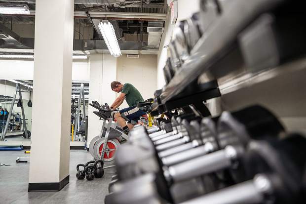 A cyclist pedals on one of the stationary bikes in the newly remodeled weight lifting area in the Aspen Rec Center on Wednesday.