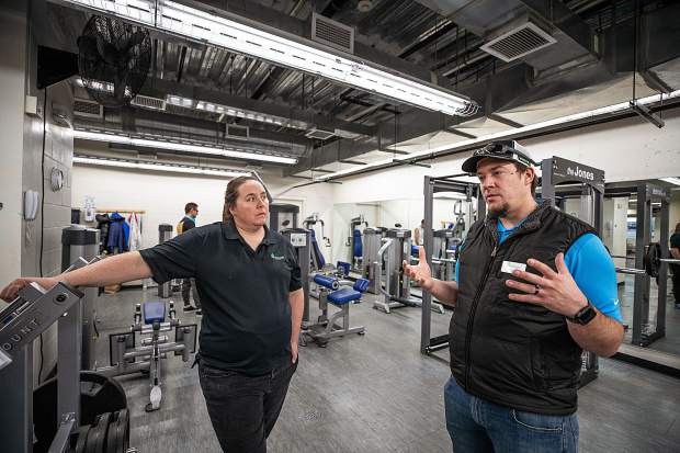 Aspen Rec Center employees Erin Hutchins and Cory Vander Veen stand and discuss further plans in the newly renovated weight-lifting room in the ARC on Wednesday.