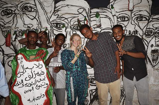 The author, center, with muralists in Khartoum, Sudan in May.