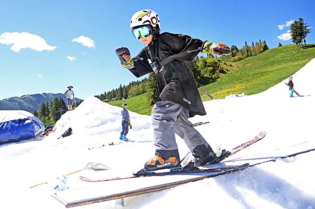 A young skier hits a rail during the 2017 AVSC Glacier Camp at Buttermilk Ski Area. (Photo by Austin Colbert/The Aspen Times).