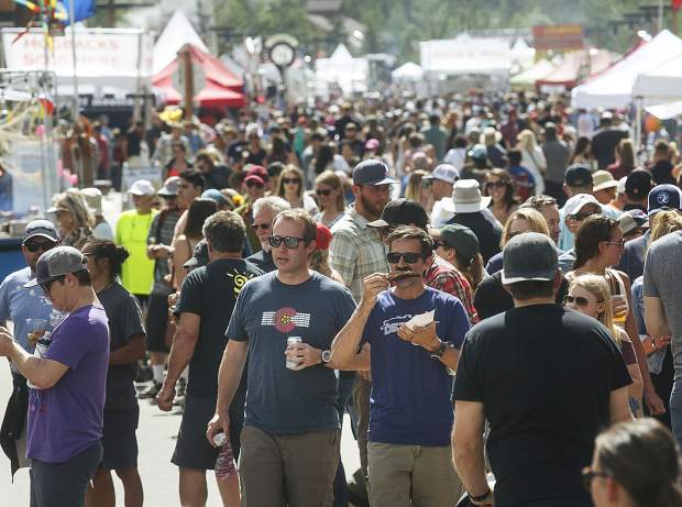 People pack Frisco's Main Street during the Colorado BBQ Challenge on Friday, June 15, 2018. Over 12,000 attendees are expected at this year's festival.