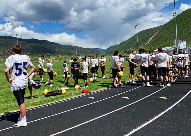 Players await the start of the Basalt High School football practice on Wednesday, June 5, 2019, on the BHS field.