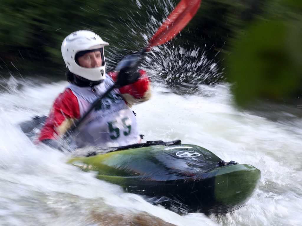 A kayaker goes through some rapids on the Roaring Fork River during the fifth annual Slaughter Fest race on Friday, July 12, 2019. The race, for kayakers, rafters or the daring stand-up paddleboarder, started at Henry Stein Park and finished at Jaffee Park in Woody Creek. (Photo by Austin Colbert/The Aspen Times)