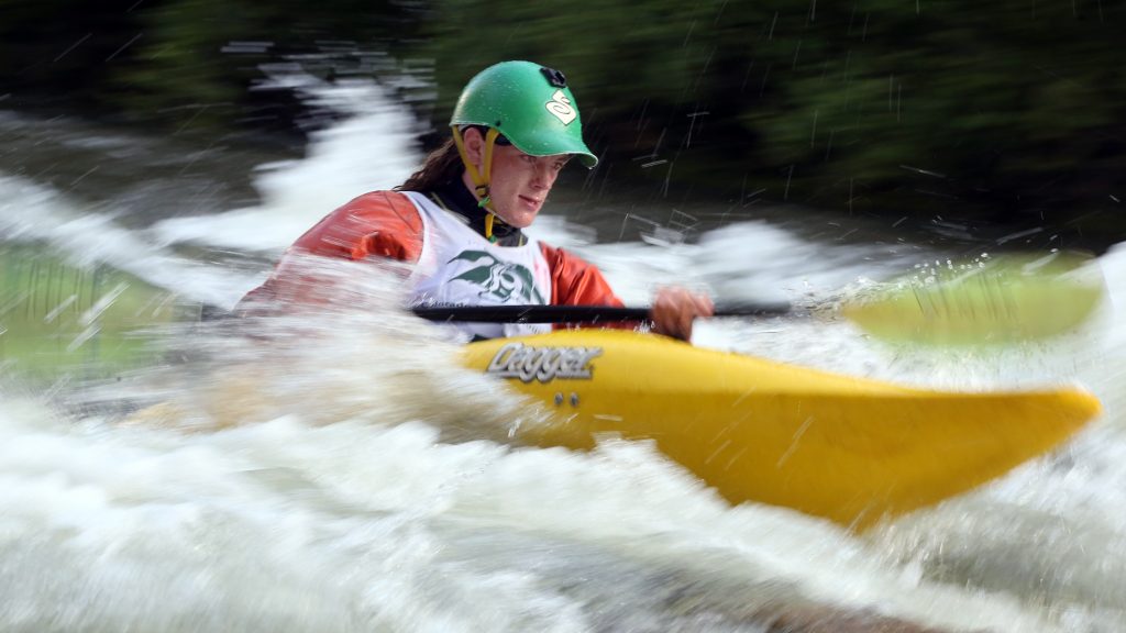 A kayaker goes through some rapids on the Roaring Fork River during the fifth annual Slaughter Fest race on Friday, July 12, 2019. The race, for kayakers, rafters or the daring stand-up paddleboarder, started at Henry Stein Park and finished at Jaffee Park in Woody Creek. (Photo by Austin Colbert/The Aspen Times)