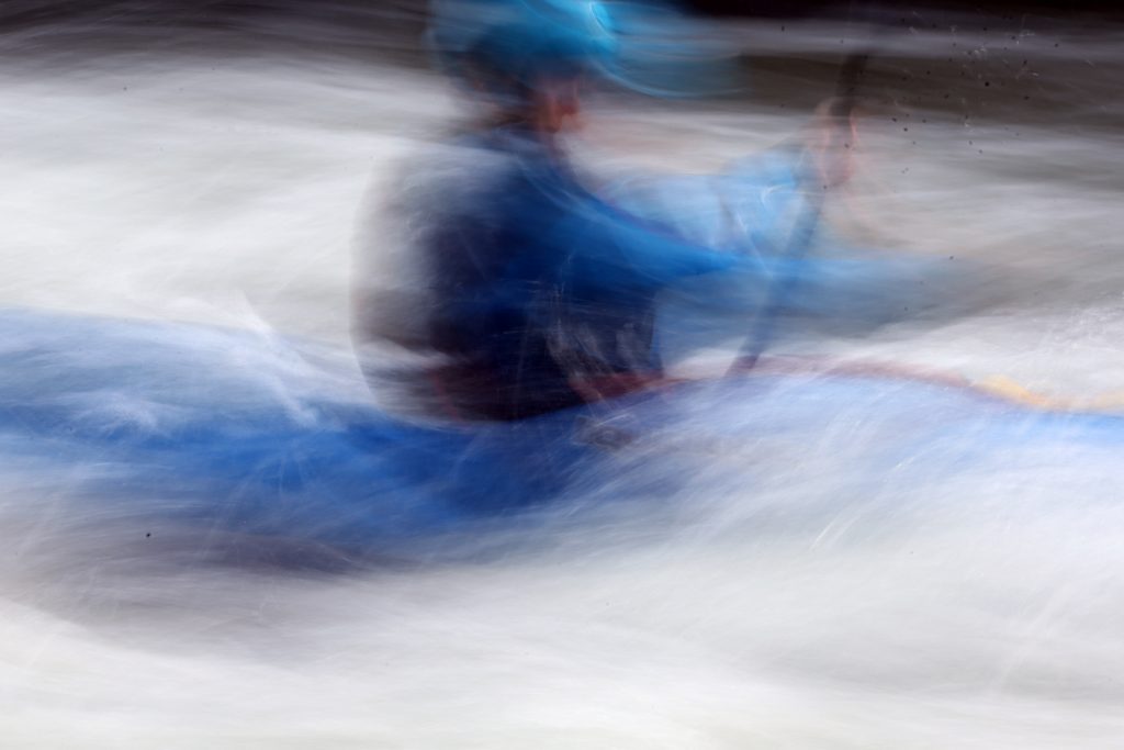 A kayaker goes through some rapids on the Roaring Fork River during the fifth annual Slaughter Fest race on Friday, July 12, 2019. The race, for kayakers, rafters or the daring stand-up paddleboarder, started at Henry Stein Park and finished at Jaffee Park in Woody Creek. (Photo by Austin Colbert/The Aspen Times)