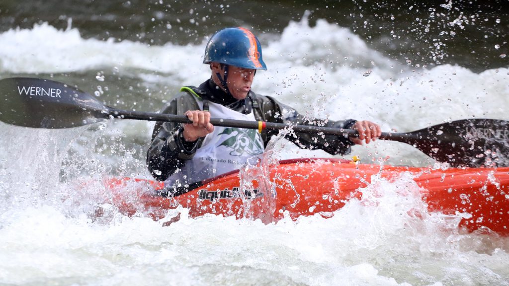 A kayaker goes through some rapids on the Roaring Fork River during the fifth annual Slaughter Fest race on Friday, July 12, 2019. The race, for kayakers, rafters or the daring stand-up paddleboarder, started at Henry Stein Park and finished at Jaffee Park in Woody Creek. (Photo by Austin Colbert/The Aspen Times)