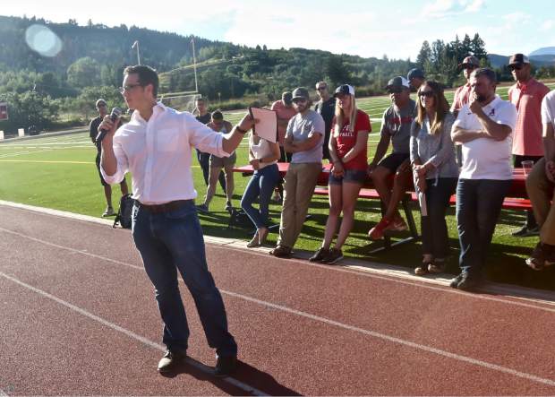 Brock USA chief media officer Josh Palubicki talks to the crowd about the Aspen School Distrct's new turf field during their annual preseason barbecue event on Wednesday, Aug. 14, 2019, in Aspen. (Photo by Austin Colbert/The Aspen Times)