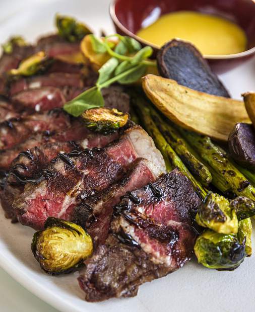 W Aspen executive chef Jackie Siao’s menu of international comfort fare includes steak with roasted vegetables