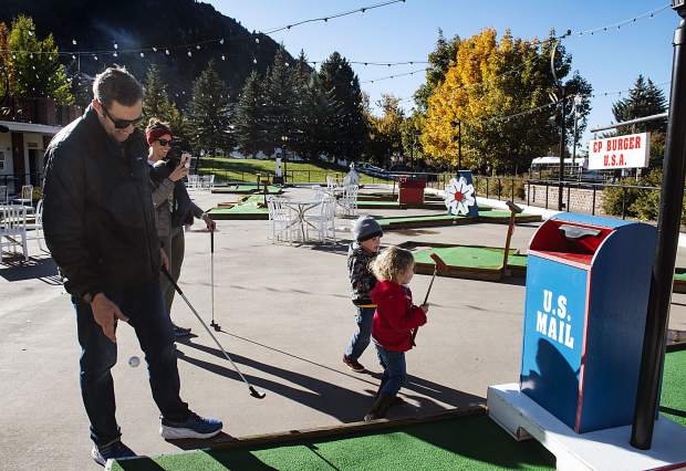 The Tetrault family start a game of mini golf outside of CP Burger on Friday, October 11, 2019. The family lives in Colorado Springs. (Kelsey Brunner/The Aspen Times)