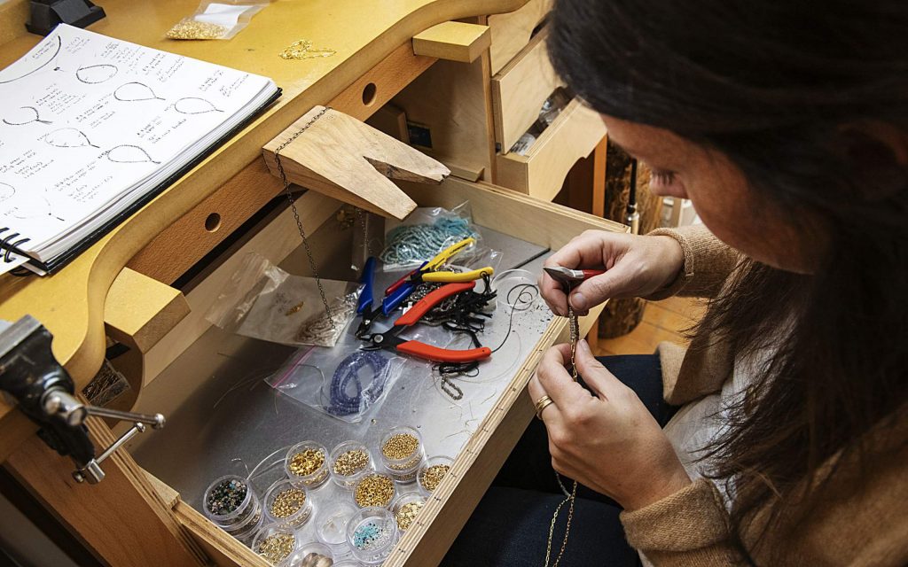 Jewelry artist Caitlin Dunn works on pieces in her studio at the Red Brick Center for the Arts in Aspen on Thursday, November 14, 2019. (Kelsey Brunner/The Aspen Times)