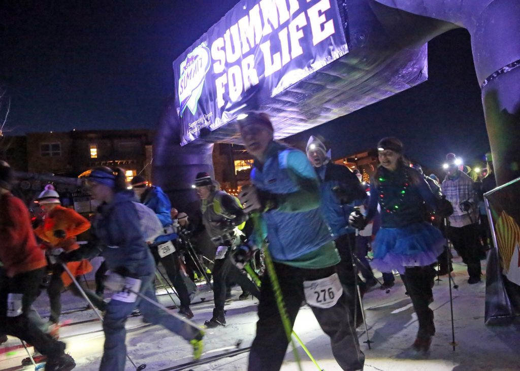 Racers take off from the start of the Summit for Life uphill race in 2017 at Aspen Mountain. (Photo by Austin Colbert/The Aspen Times)