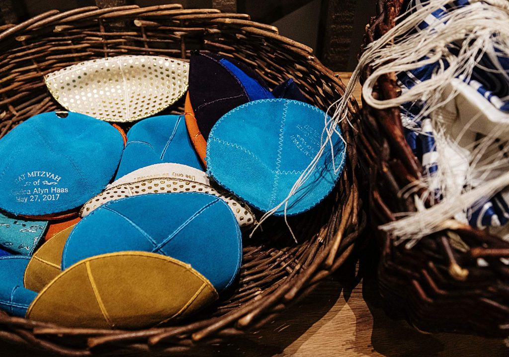 A basket of yarmulkes sit by the front entrance of the Aspen Chapel before Friday Shabbat service.