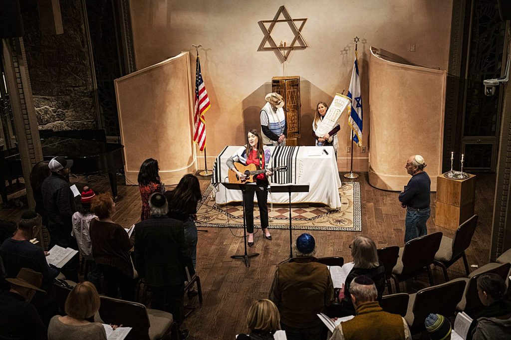Rabbi Emily Segal leads a congregation through a Friday evening Shabbat at the Aspen Chapel..