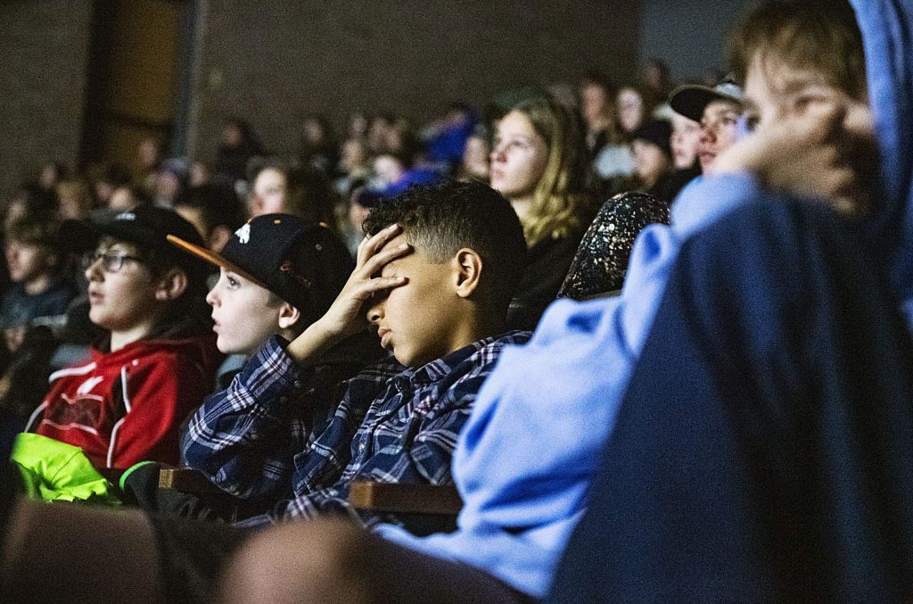 Aspen Middle School students watch an emotional film about the Holocaust at the end of the Remembrance Day Ceremony in the Aspen District Theater on Thursday, Jan. 30, 2020. January 27th has been designated by the United National as a day of commemoration to the victims of the Holocaust and as a day to educate about the genocide. This year is the 75th anniversary of the closing of Auschwitz death camp. (Kelsey Brunner/The Aspen Times)