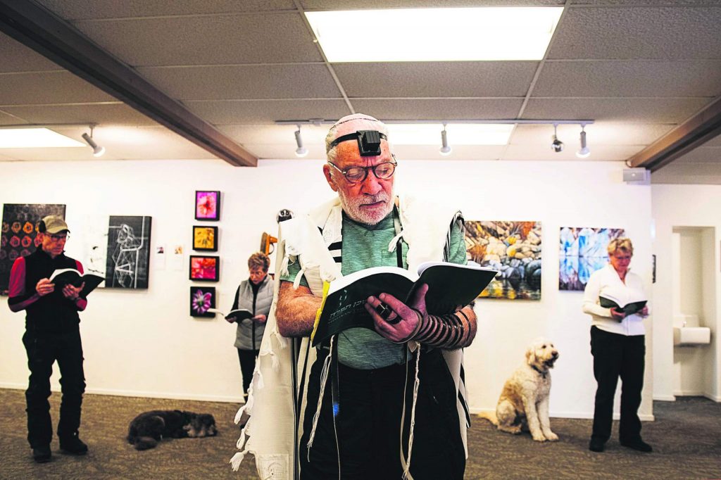 Mark Parnass leads a morning Kaddish prayer circle in the gallery of the Aspen Chapel on Wednesday, Feb. 18, 2020. (Kelsey Brunner/The Aspen Times)