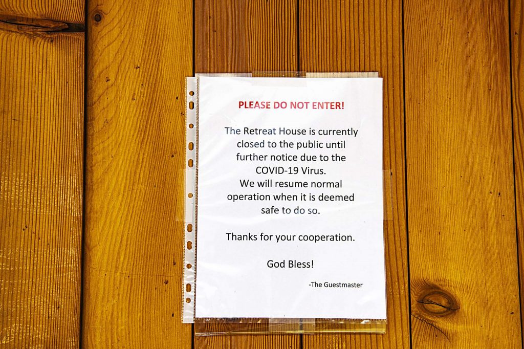 A sign announcing the closure of The Retreat House hangs on a door at St. Benedict’s Monastery in Old Snowmass on Tuesday, April 14, 2020. (Kelsey Brunner/Snowmass Sun)